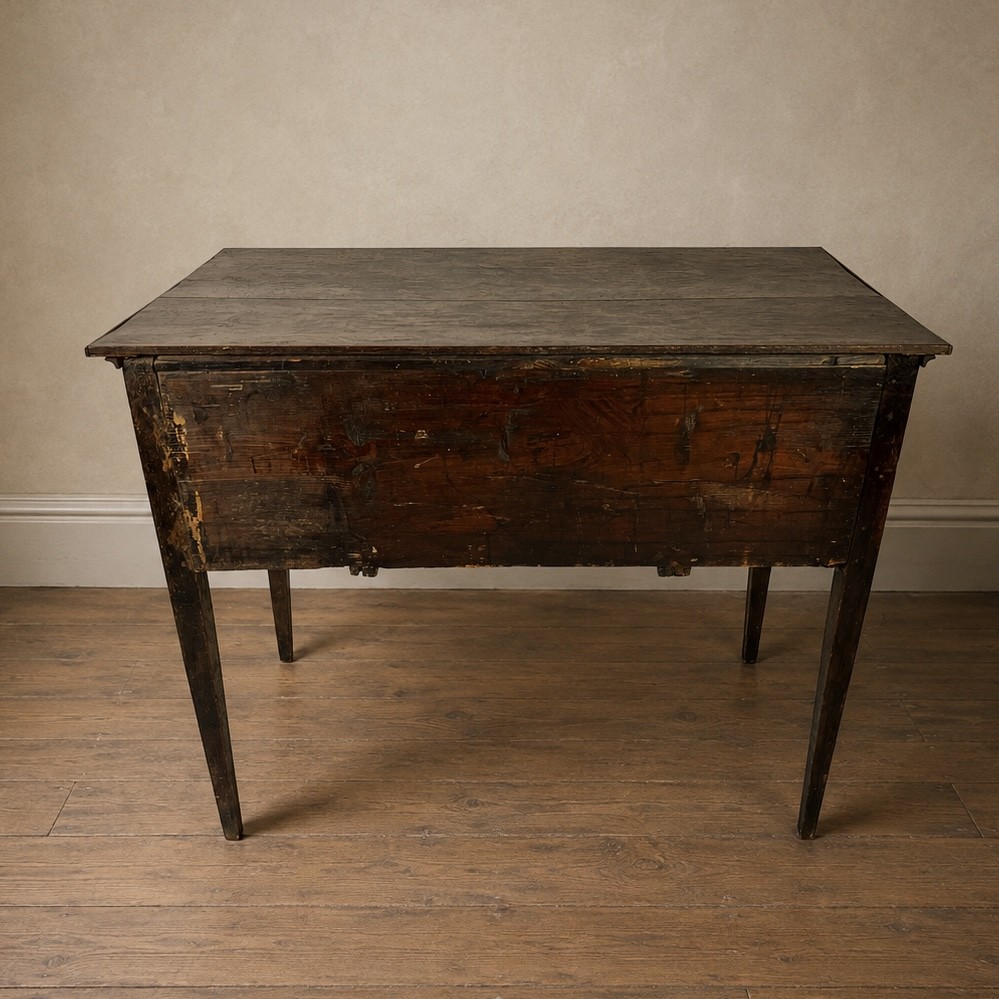 An 18th-century Georgian dark oak lowboy side table featuring three drawers with brass handles, a shaped apron, and slender square legs. View IV