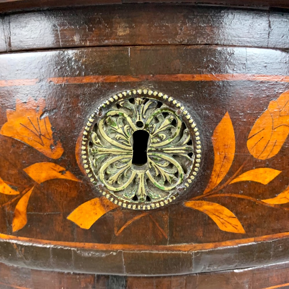An 18th-century Dutch walnut side table featuring a serpentine front, floral marquetry inlay, a single drawer, and four square tapered legs. View XIII