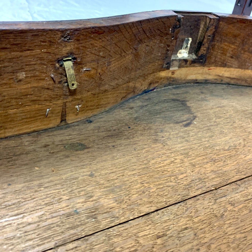 An 18th-century Dutch walnut side table featuring a serpentine front, floral marquetry inlay, a single drawer, and four square tapered legs. View XIV
