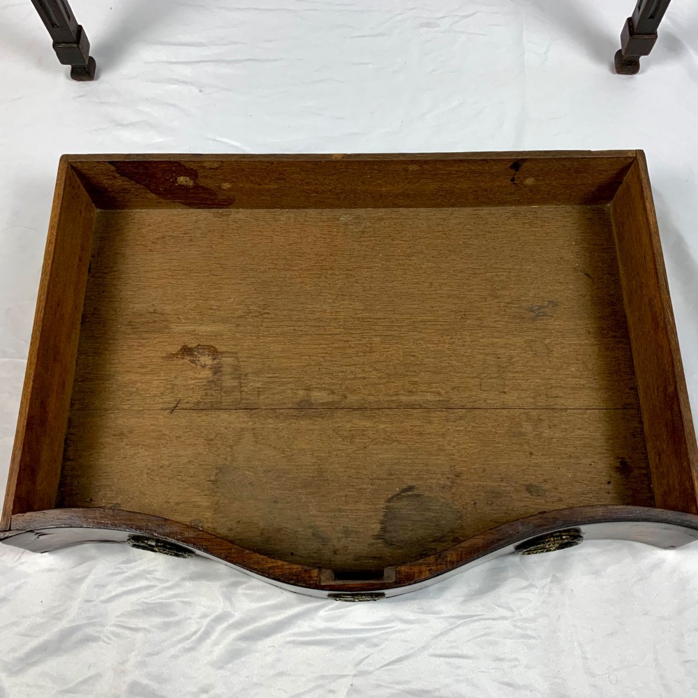 An 18th-century Dutch walnut side table featuring a serpentine front, floral marquetry inlay, a single drawer, and four square tapered legs. View XV