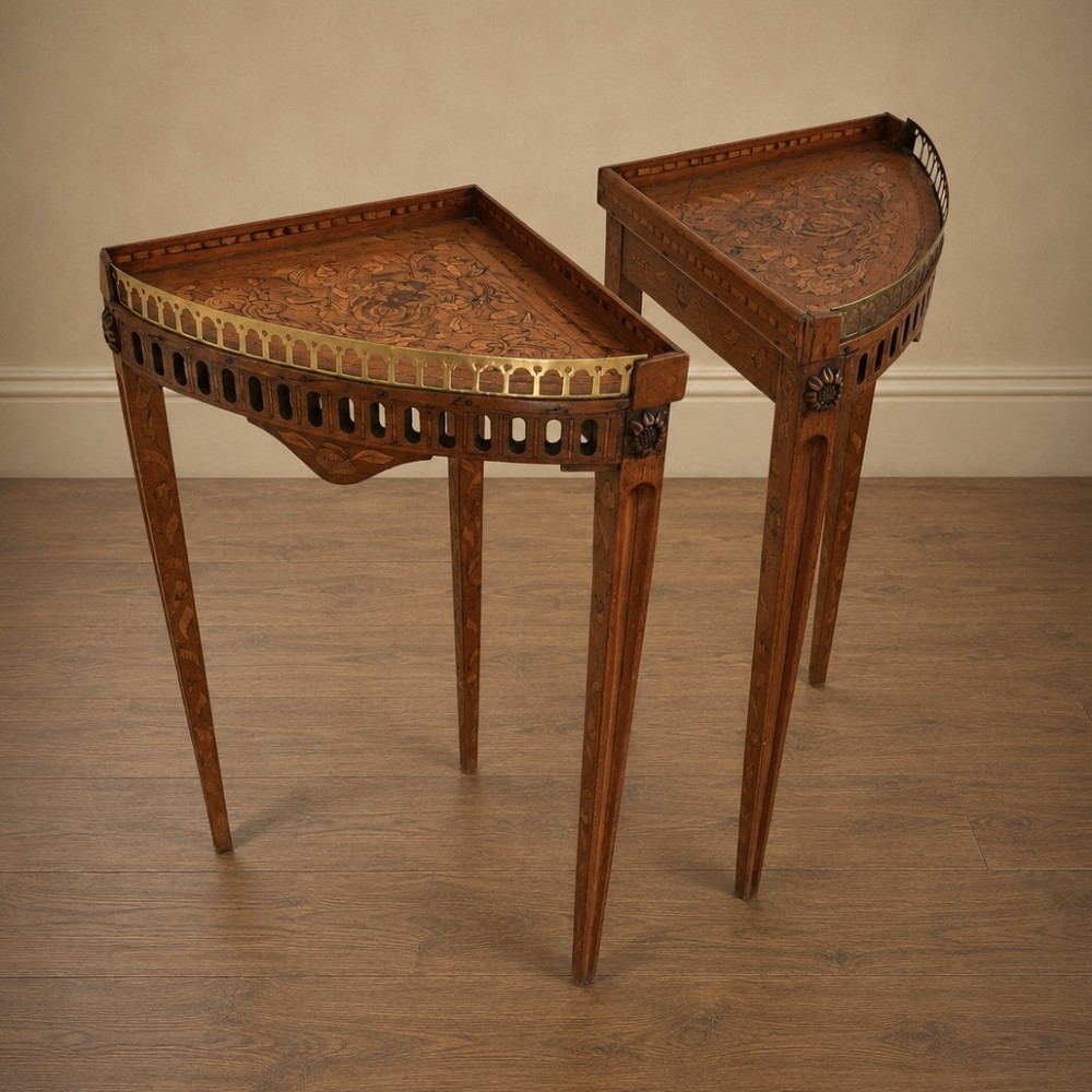 A pair of 18th-century triangular corner tables featuring detailed floral marquetry top surfaces, pierced friezes, tapering legs, and brass galleries. View VIII