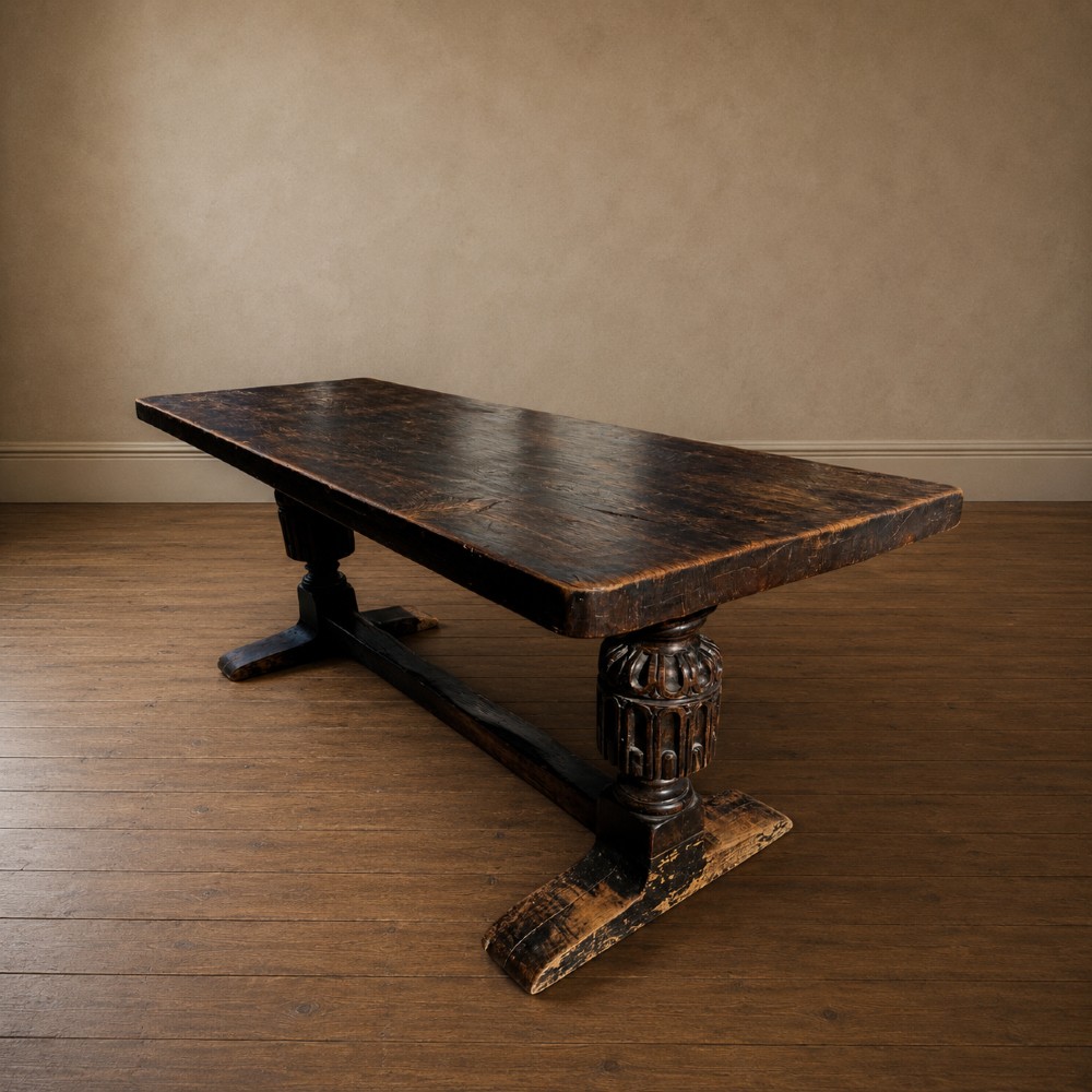 A 17th-century oak and elm refectory dining table featuring a solid single-plank top over thick carved bulbous pedestal supports and a low central stretcher rail. View XV