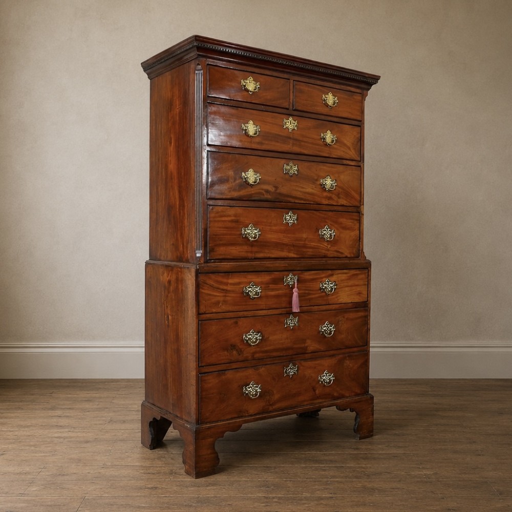 A late 18th-century George III mahogany chest on chest featuring brass swan-neck handles, keyhole escutcheons, dentil moulding, and bracket feet. View XIV