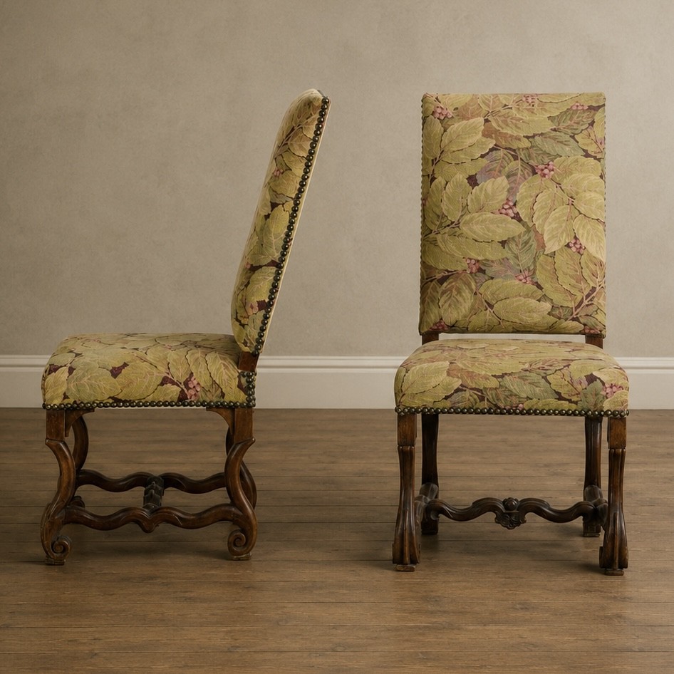 A pair of late 19th-century French walnut side chairs with high upholstered backs in a leafy green tapestry fabric and carved curved legs. View XIV