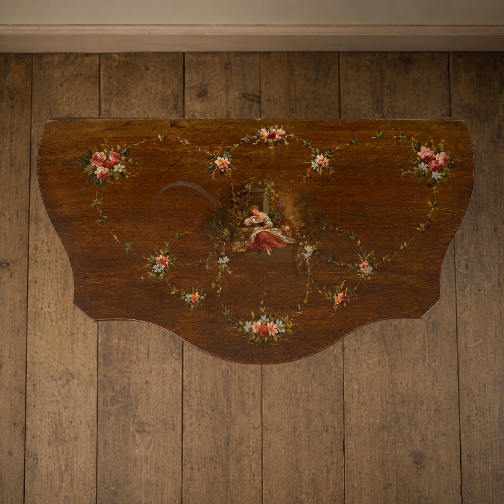 A dark mahogany serpentine-front side cabinet with hand-painted floral swags and figurative door panel vignettes resting on slender square tapered legs. View VI