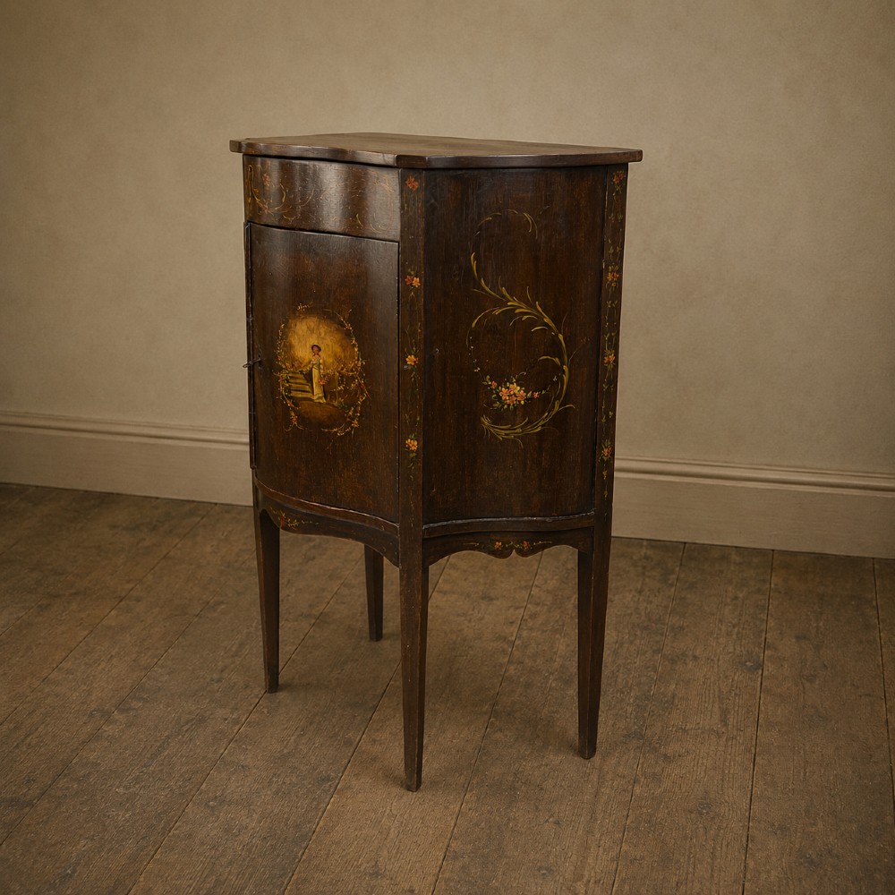 A dark mahogany serpentine-front side cabinet with hand-painted floral swags and figurative door panel vignettes resting on slender square tapered legs. View XIII