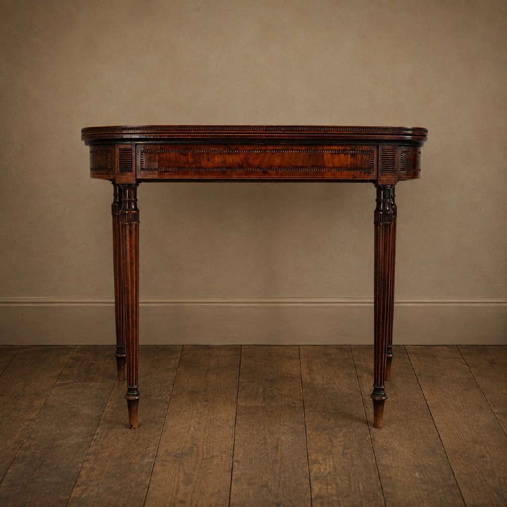 An antique Regency rosewood fold-over card table featuring burr yew crossbanding, a rectangular top with rounded corners, and slender fluted tapered legs. View III