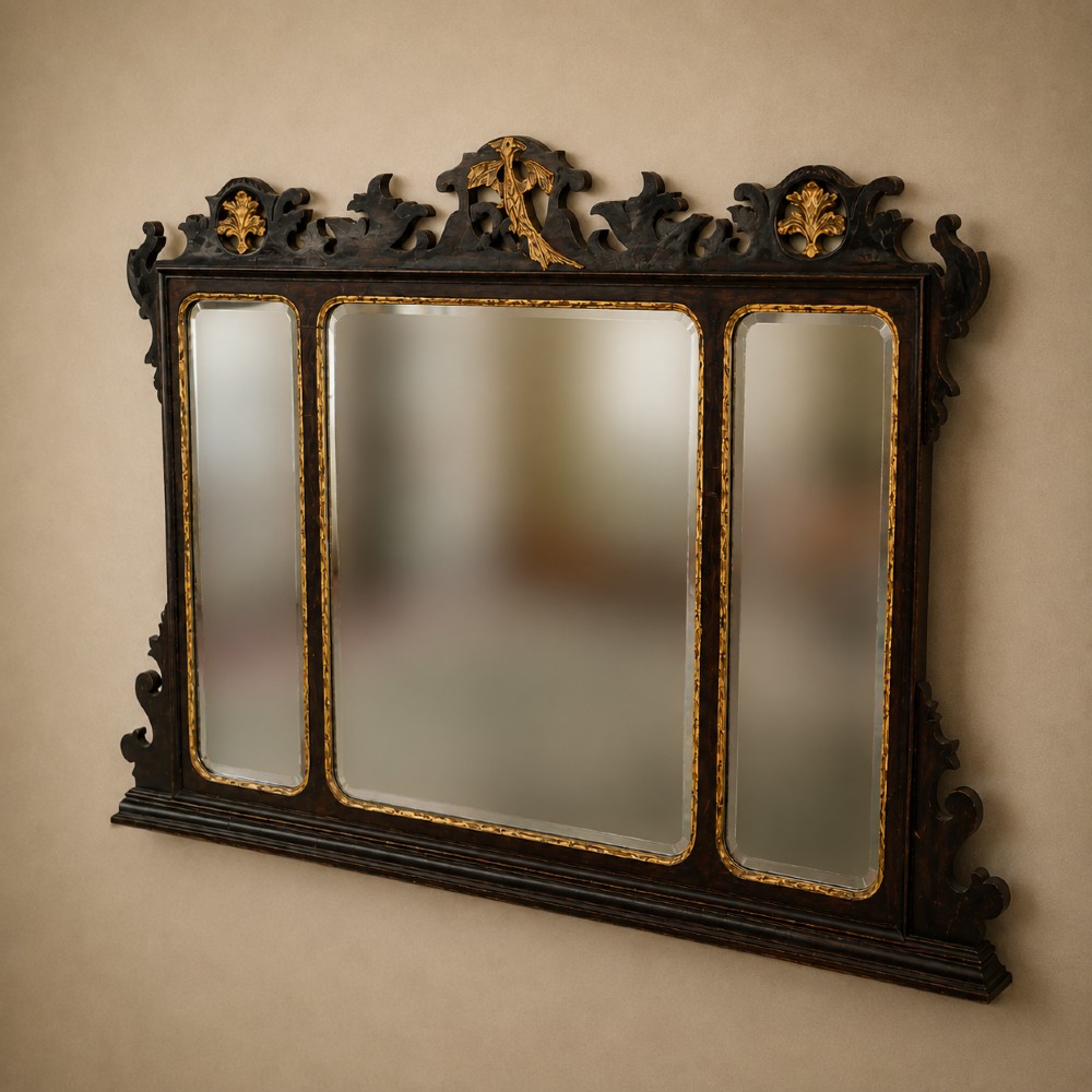 A dark mahogany triptych overmantel mirror with carved pierced fretwork, three mirror panels, and a gilded ho-ho bird cresting. View X