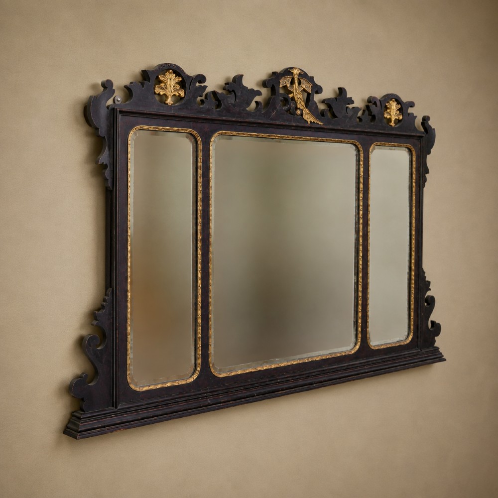A dark mahogany triptych overmantel mirror with carved pierced fretwork, three mirror panels, and a gilded ho-ho bird cresting. View XI