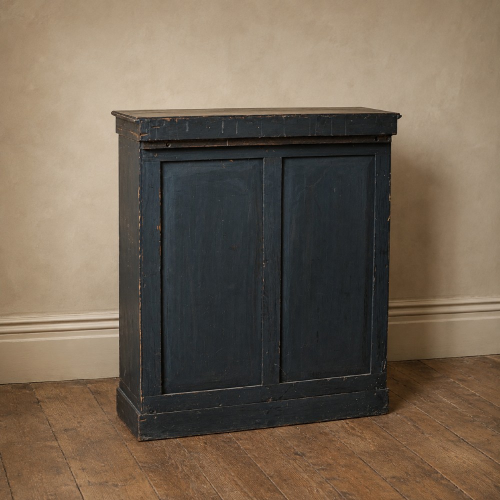 An antique William IV rosewood open bookcase featuring two adjustable shelves, a solid plinth base, and carved scroll capitals atop side pilasters. View XV