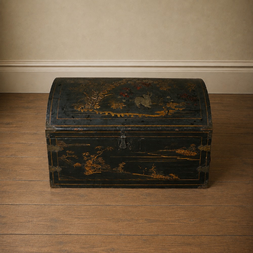 A 19th-century black lacquered domed storage trunk decorated with gilded chinoiserie landscape scenes and metal corner hardware. View XIII