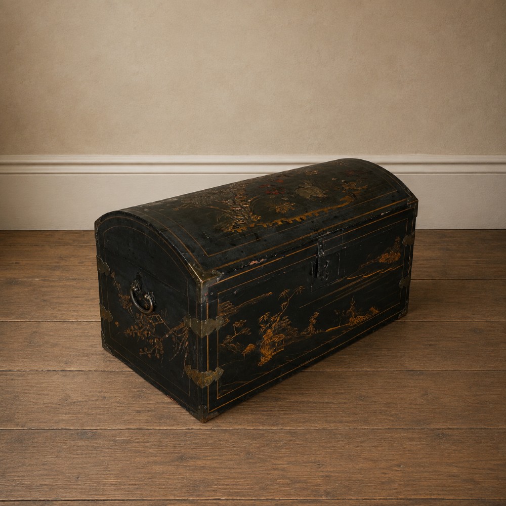 A 19th-century black lacquered domed storage trunk decorated with gilded chinoiserie landscape scenes and metal corner hardware. View XIV