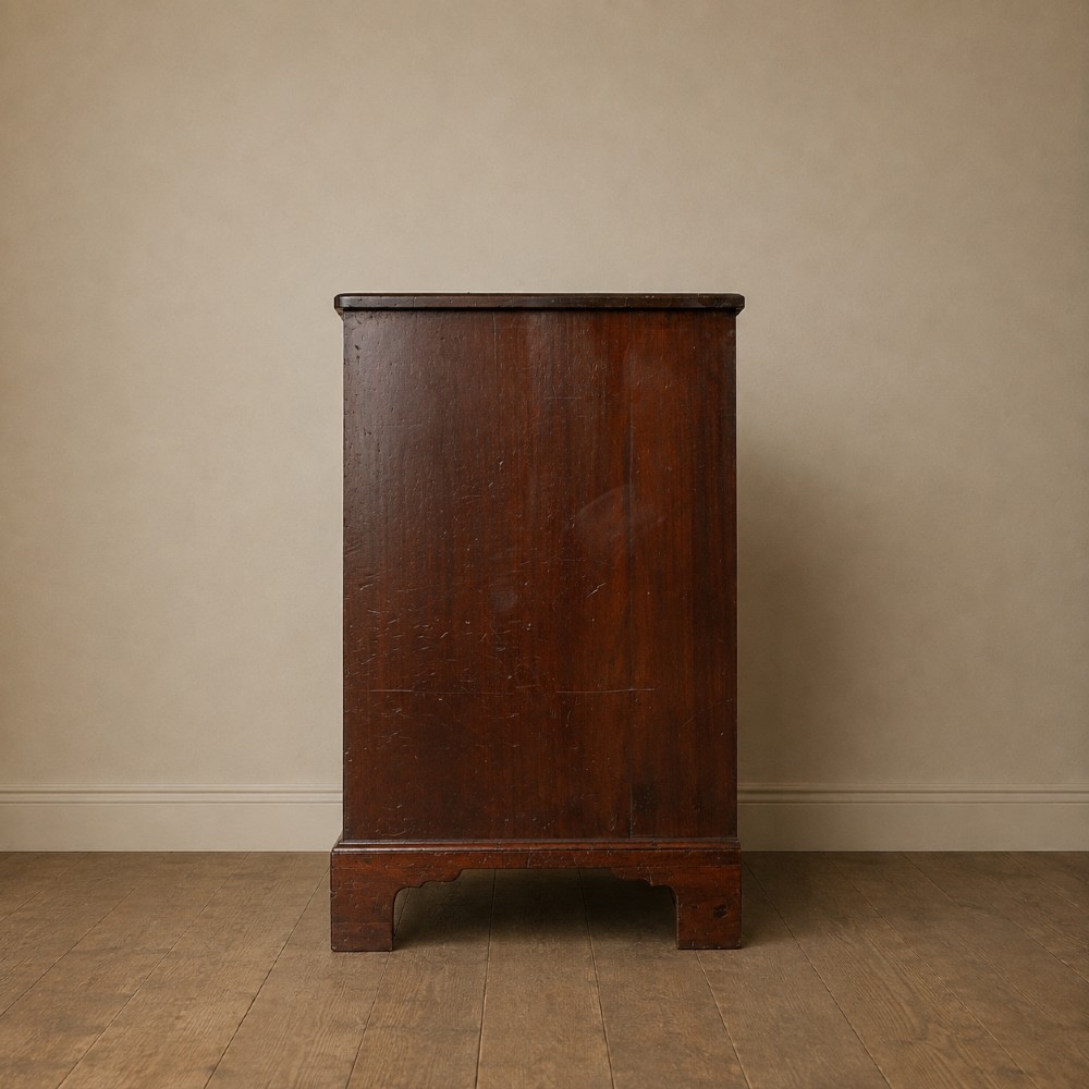 A George II dark mahogany straight-front chest featuring four graduated long drawers with decorative brass swan-neck handles and bracket feet. View IV