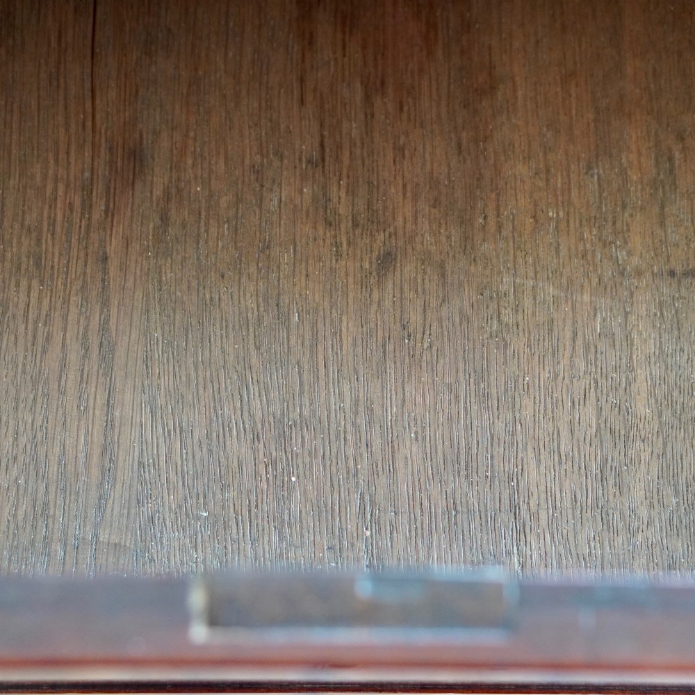 A George II dark mahogany straight-front chest featuring four graduated long drawers with decorative brass swan-neck handles and bracket feet. View XIII