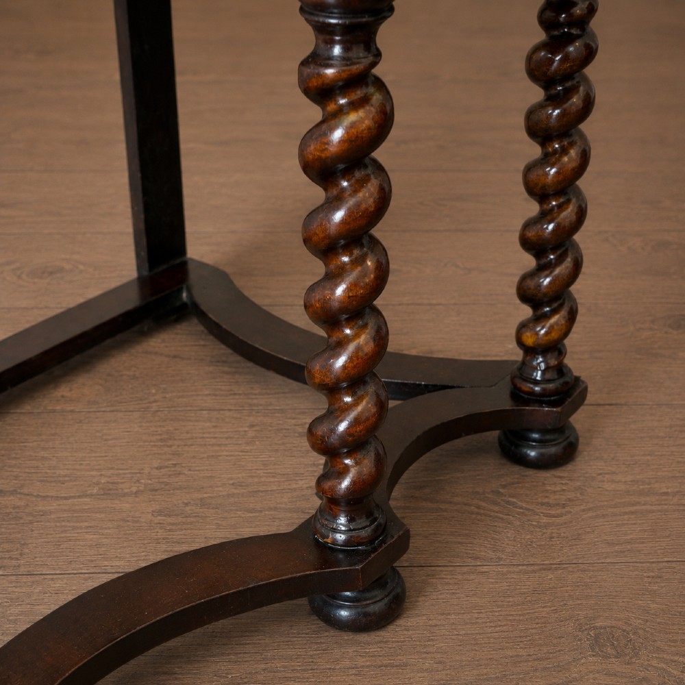 A George I period figured walnut chest on stand featuring engraved brass escutcheons and six barley-twist legs. View XII