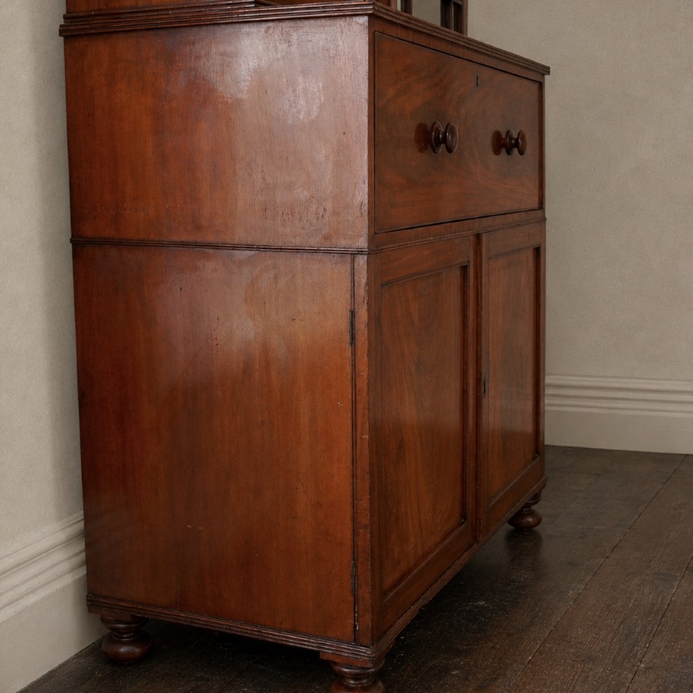 A nineteenth-century George IV mahogany secretaire bookcase with glazed upper doors featuring gothic tracery and a drop-down desk drawer revealing a fitted interior. View XIII