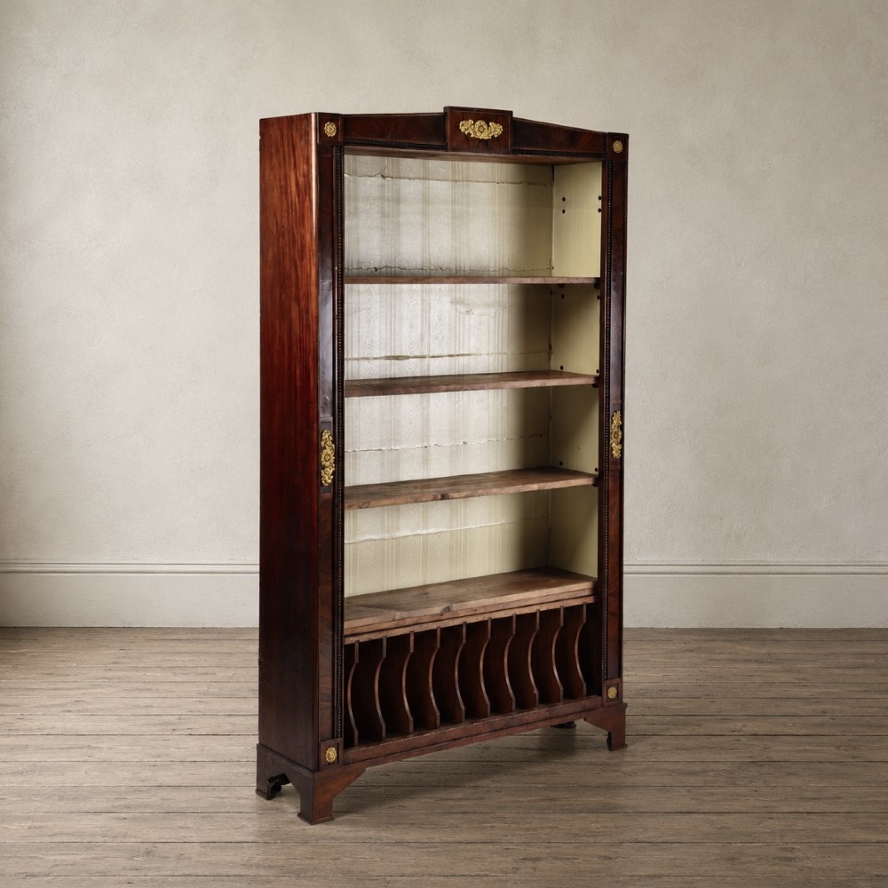 A nineteenth-century French Empire style rosewood open bookcase featuring brass mounts and adjustable shelves above vertical dividers. View II