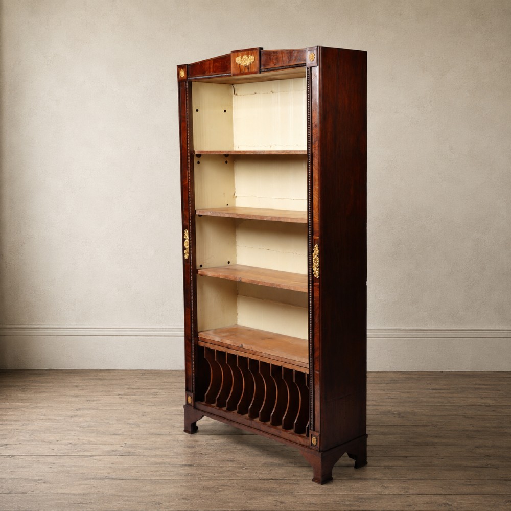 A nineteenth-century French Empire style rosewood open bookcase featuring brass mounts and adjustable shelves above vertical dividers. View III