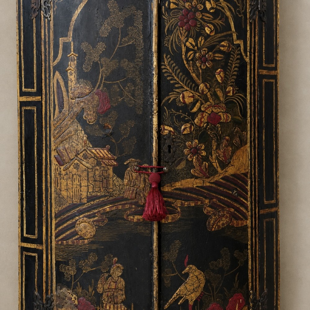 A nineteenth-century bow-front corner cupboard crafted in dark black lacquer with gold hand-painted chinoiserie figures and architectural scenes. View III
