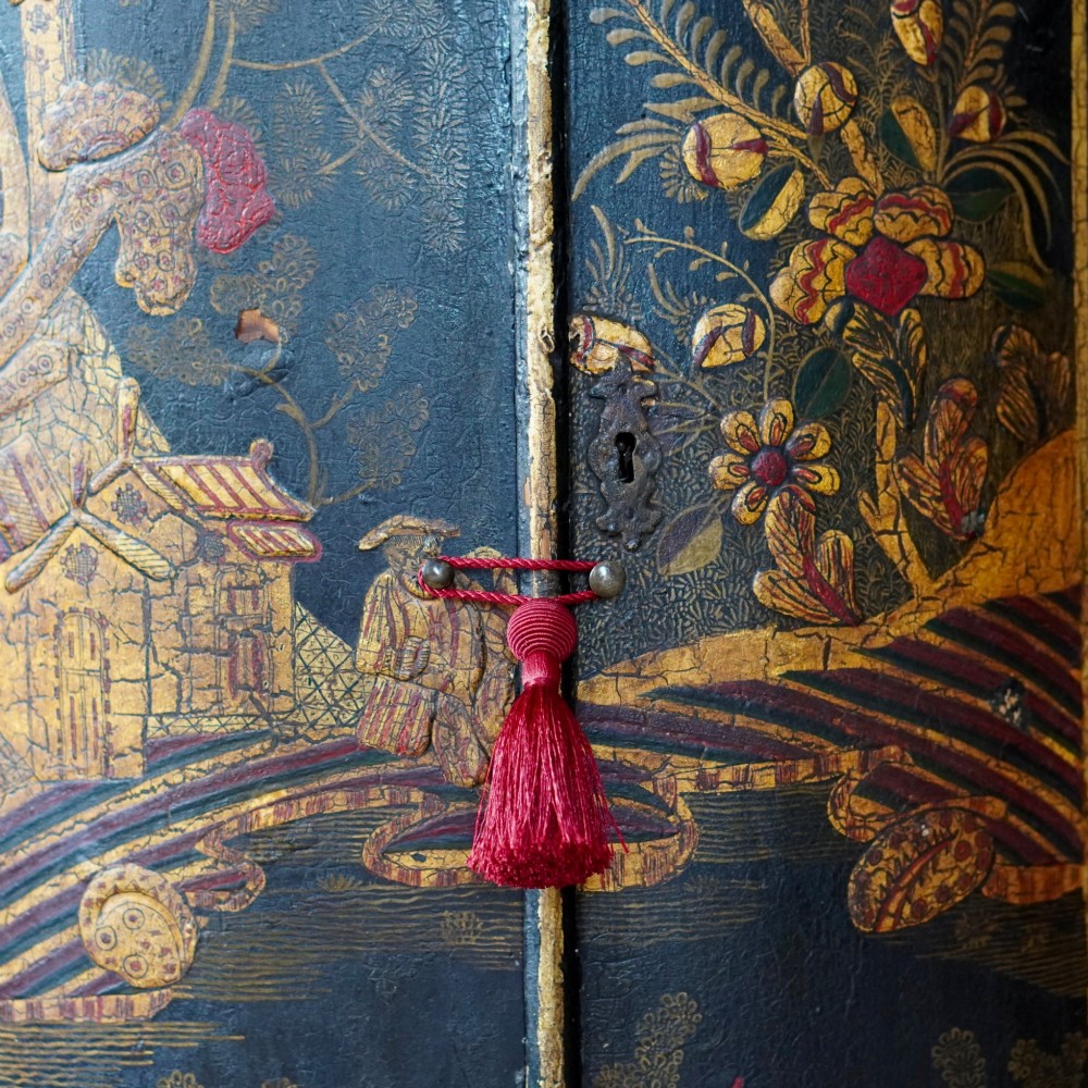 A nineteenth-century bow-front corner cupboard crafted in dark black lacquer with gold hand-painted chinoiserie figures and architectural scenes. View VI