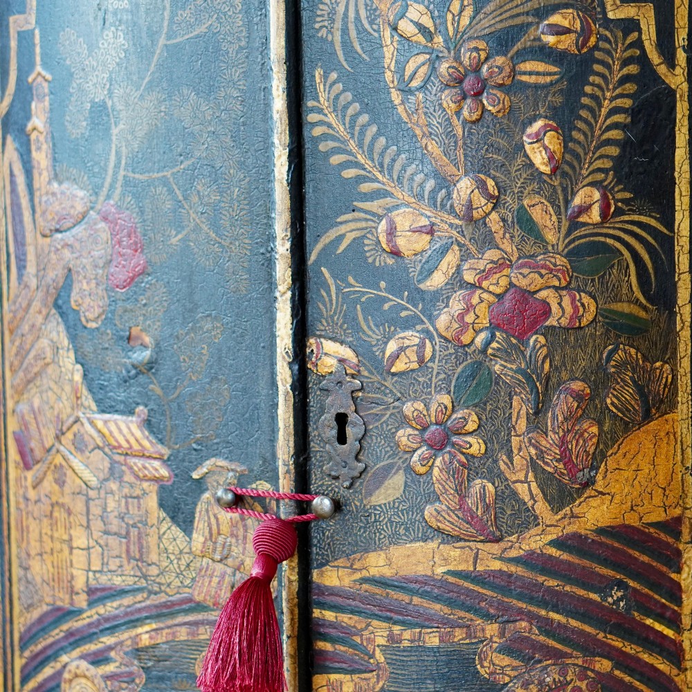 A nineteenth-century bow-front corner cupboard crafted in dark black lacquer with gold hand-painted chinoiserie figures and architectural scenes. View VII