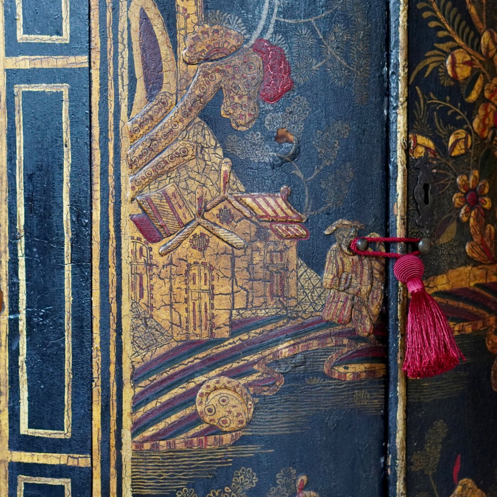 A nineteenth-century bow-front corner cupboard crafted in dark black lacquer with gold hand-painted chinoiserie figures and architectural scenes. View IX