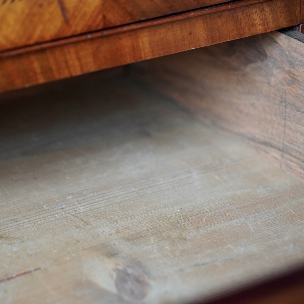 A 19th-century mahogany tray top night commode featuring two cabinet doors with oval marquetry inlays above two drawers with brass handles. View IX