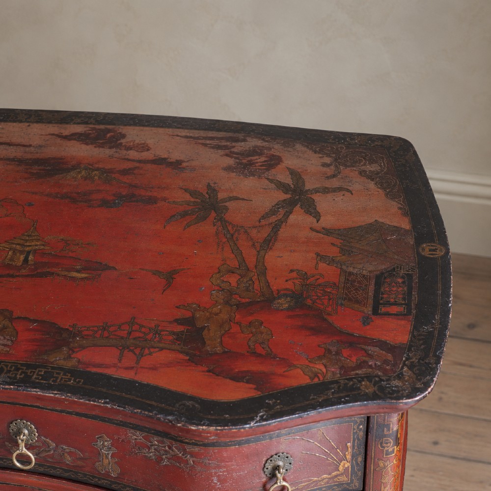 A late nineteenth-century kidney-shaped red lacquered Chinoiserie dressing table featuring four drawers, hand-painted oriental scenes, and cabriole legs. View VII