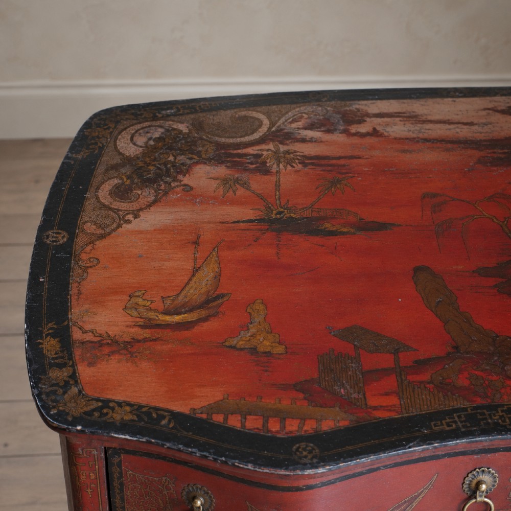A late nineteenth-century kidney-shaped red lacquered Chinoiserie dressing table featuring four drawers, hand-painted oriental scenes, and cabriole legs. View VIII