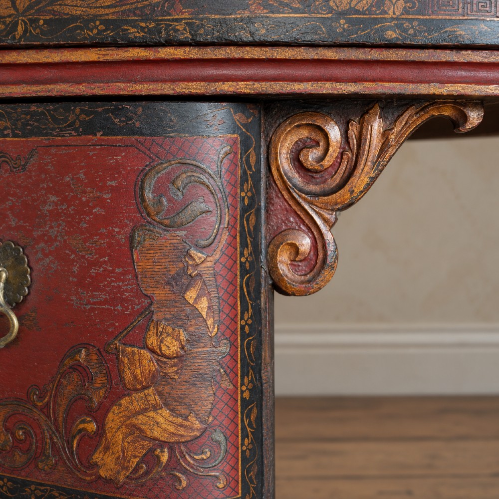 A late nineteenth-century kidney-shaped red lacquered Chinoiserie dressing table featuring four drawers, hand-painted oriental scenes, and cabriole legs. View X