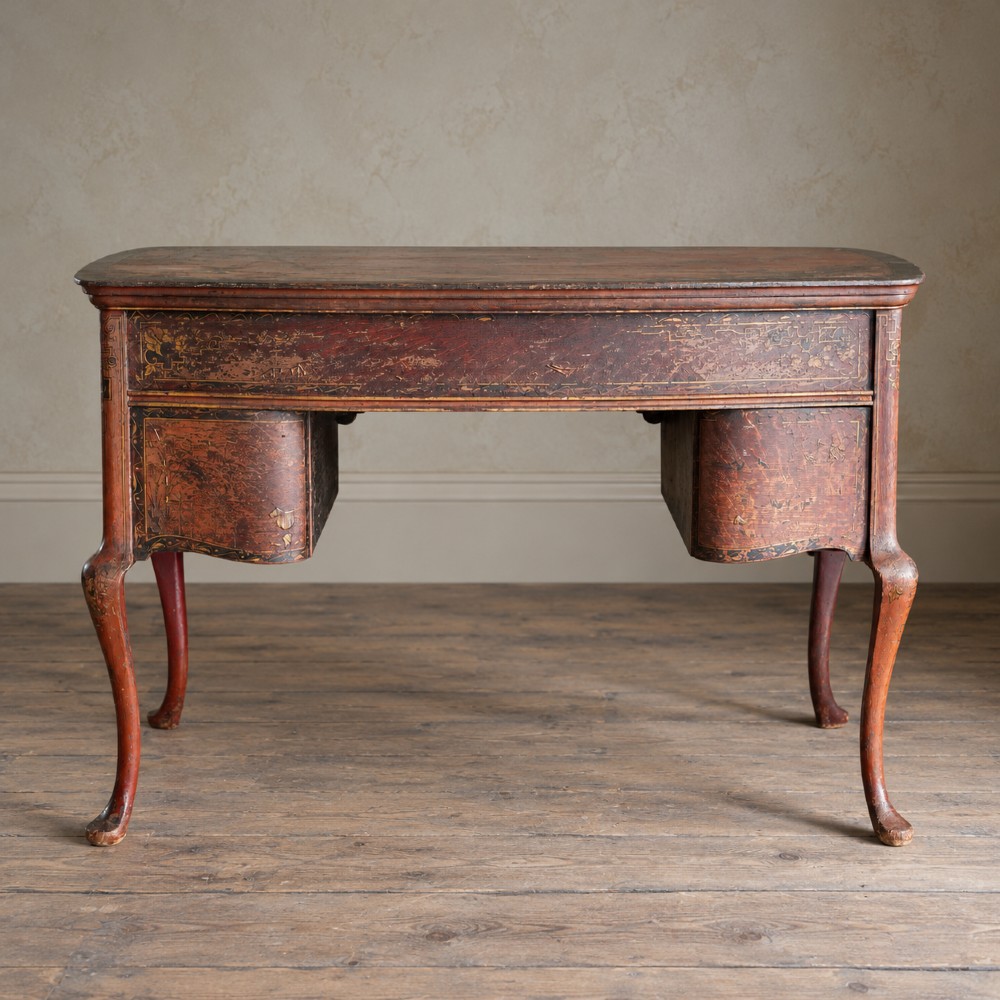 A late nineteenth-century kidney-shaped red lacquered Chinoiserie dressing table featuring four drawers, hand-painted oriental scenes, and cabriole legs. View XI