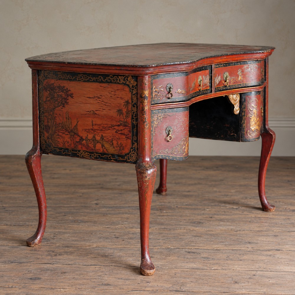 A late nineteenth-century kidney-shaped red lacquered Chinoiserie dressing table featuring four drawers, hand-painted oriental scenes, and cabriole legs. View XII