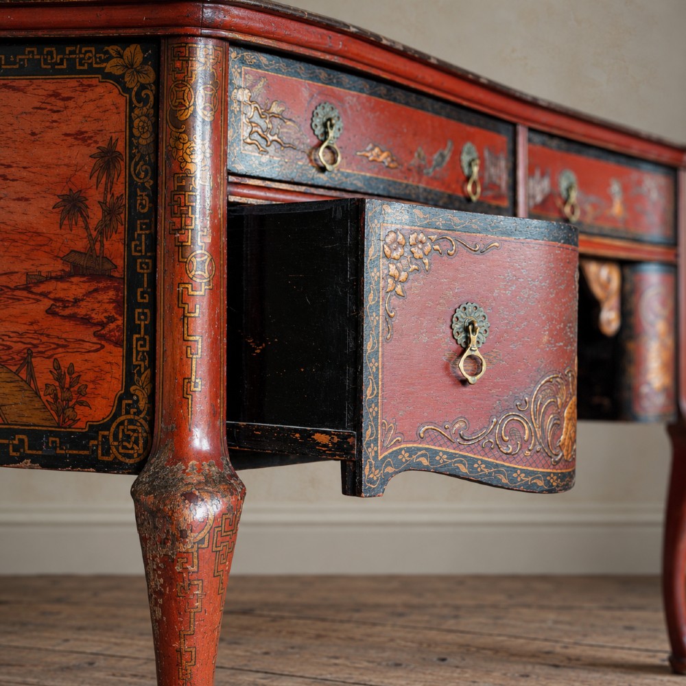 A late nineteenth-century kidney-shaped red lacquered Chinoiserie dressing table featuring four drawers, hand-painted oriental scenes, and cabriole legs. View XIII
