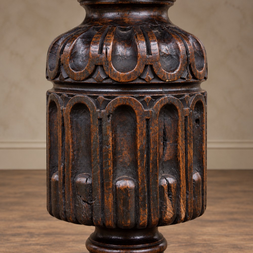 A 17th-century oak and elm refectory dining table featuring a solid single-plank top over thick carved bulbous pedestal supports and a low central stretcher rail. View XII