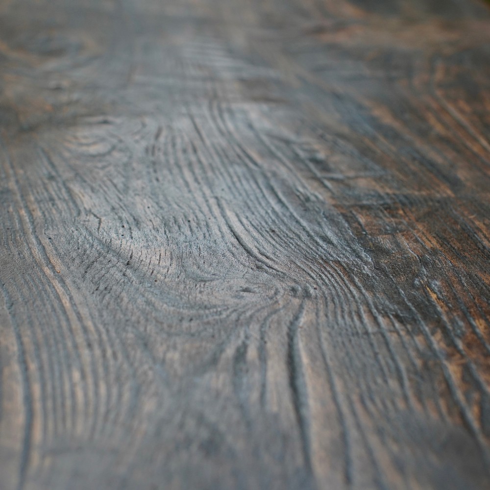 A 17th-century oak and elm refectory dining table featuring a solid single-plank top over thick carved bulbous pedestal supports and a low central stretcher rail. View XV