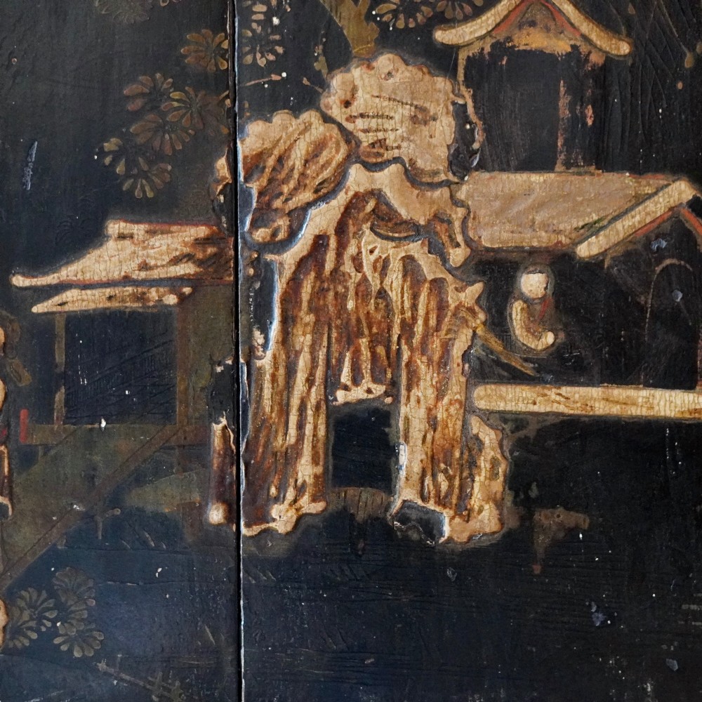 An 18th-century black japanned single-door wall corner cupboard featuring hand-painted gold Chinoiserie figures, architectural motifs, and brass butterfly hinges. View V