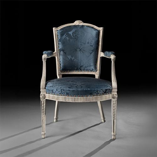 fig 1. A pair of George III style cream-painted armchairs with fluted legs and blue floral damask upholstery.