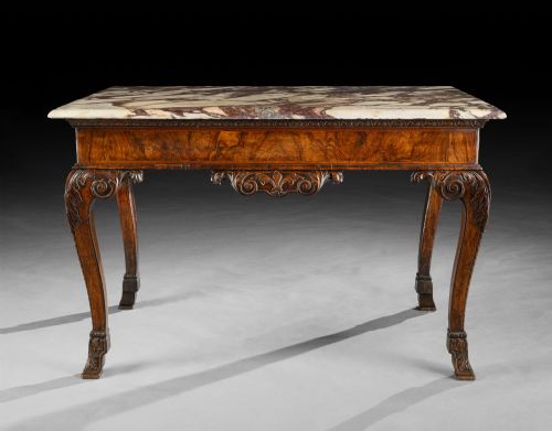 fig 3. An 18th-century George II carved walnut side table featuring a variegated marble top, carved frieze, and cabriole legs with leaf details.
