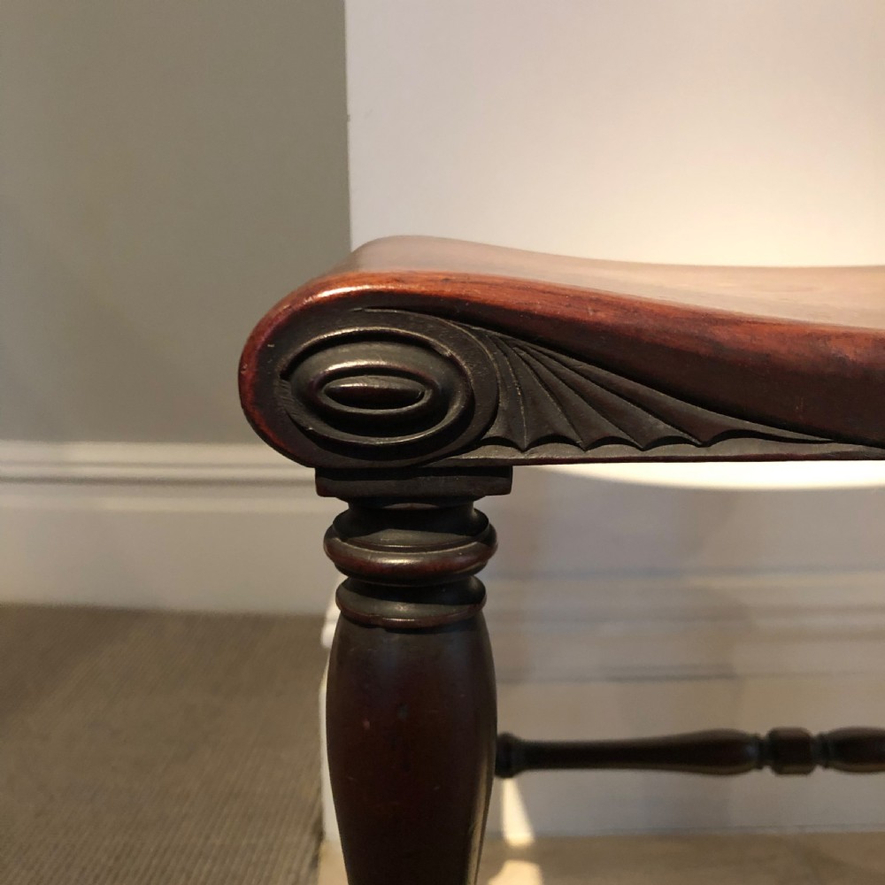 A FINE PAIR OF GEORGE III PERIOD MAHOGANY HALL STOOLS View II