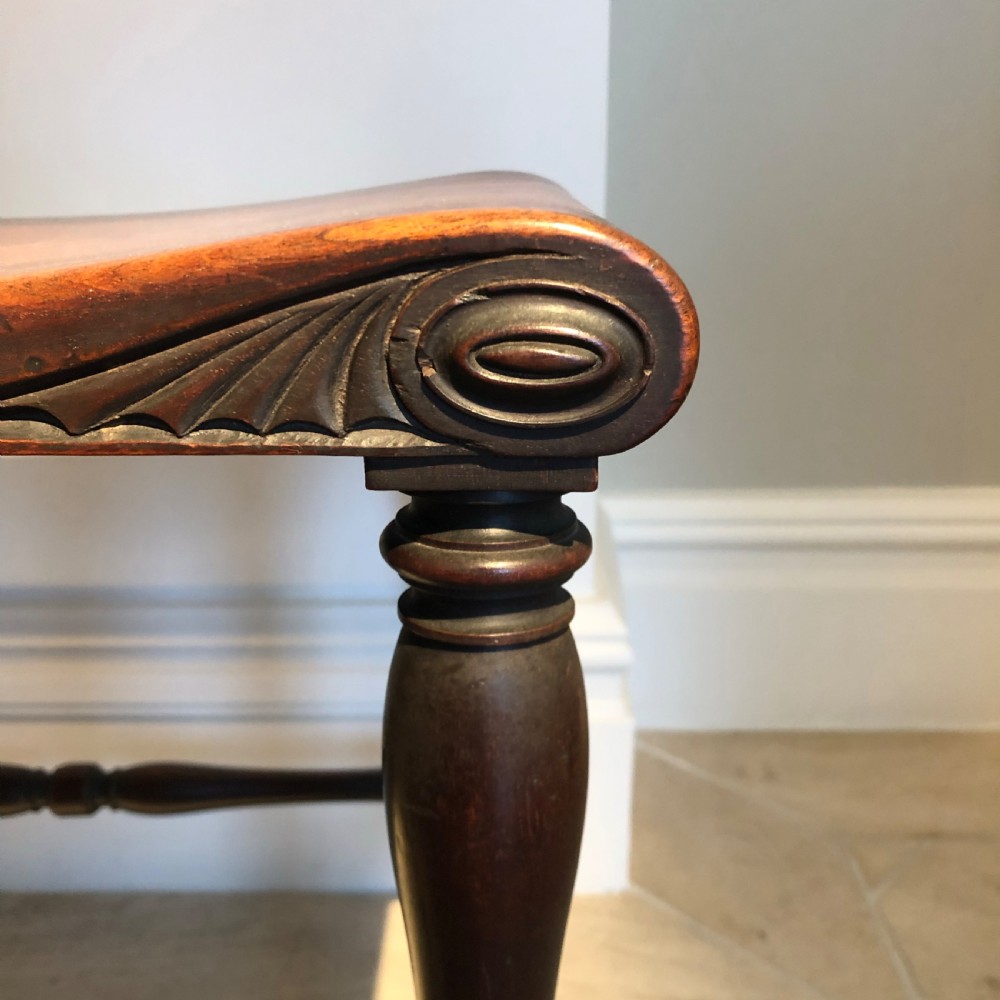 A FINE PAIR OF GEORGE III PERIOD MAHOGANY HALL STOOLS View V