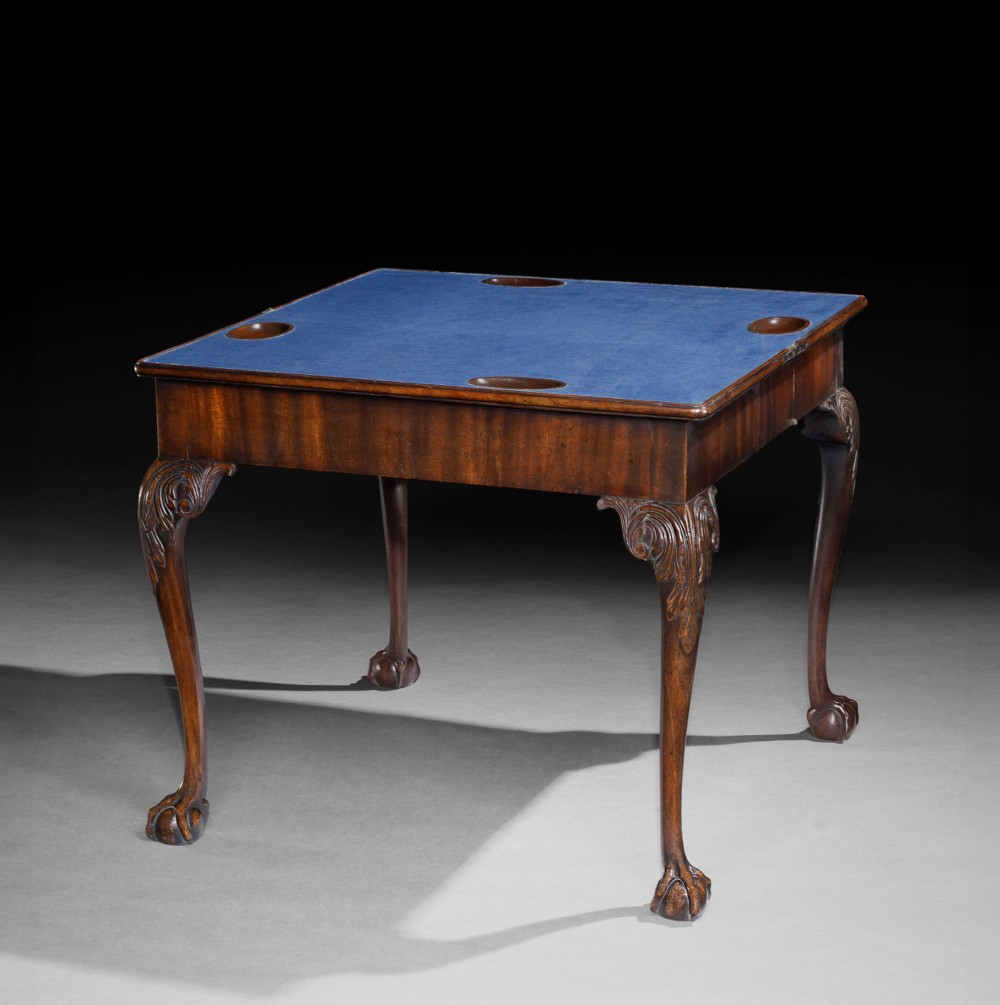 A George II mahogany fold-over card table featuring carved acanthus knees, cabriole legs, and claw and ball feet. View II