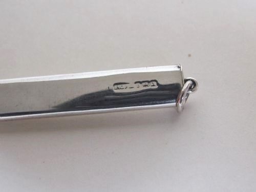 fig 2. An extremely rare pair of silver cased folding scissors.