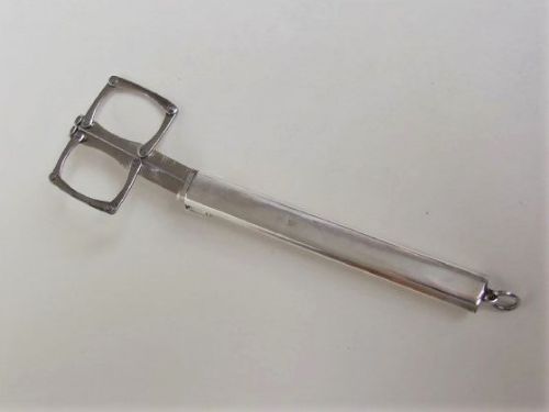 An Extremely Rare Pair of Silver Cased Folding Scissors.
