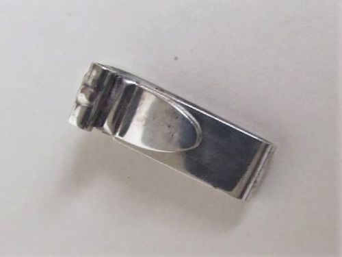 An Unusual George V Silver Napkin Clip.