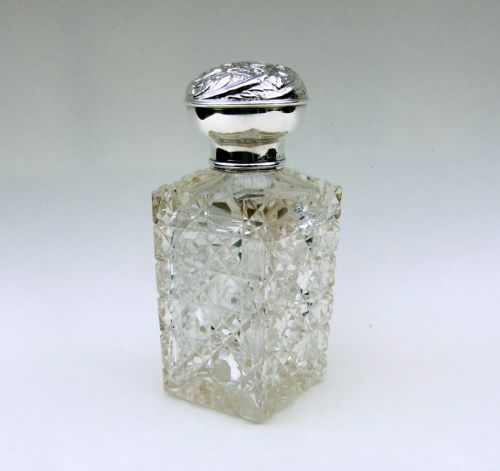 A Lovely Edwardian Silver Mounted Cologne Bottle