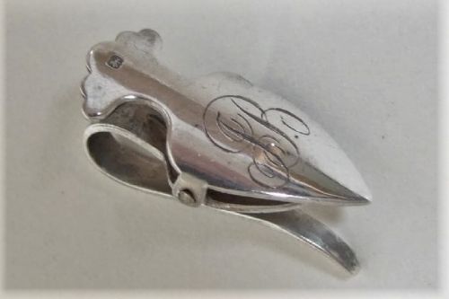 An Edwardian Shield Shaped Napkin Clip.