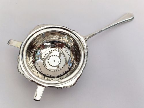 A Gorgeous George V Silver Tea Strainer.