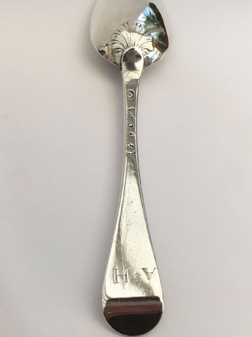 fig 1. A fabulous and rare mid 18th century silver shell back serving spoon - Female silversmith