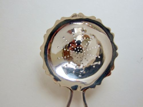 fig 1. An unusual George V silver tea strainer.