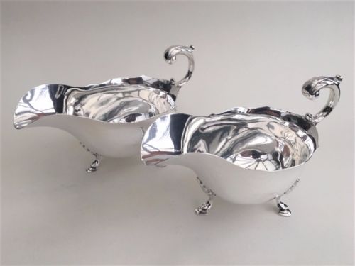 An Impressive Matching Pair of Silver Gravy Boats.